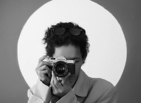 woman coat camera photographer 7883774